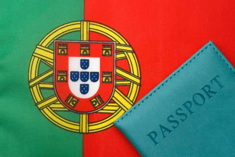Portugal golden visa requirements concept featuring a passport and Portugal flag